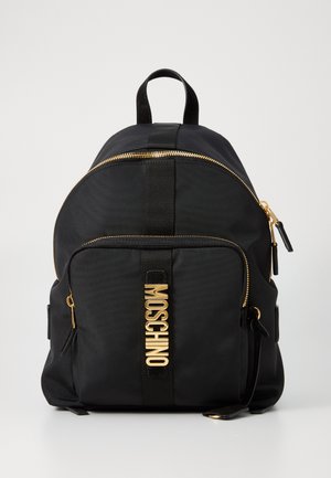 Black nylon backpack with a curved top, gold zipper, and Moschino logo in shiny gold. Features adjustable straps and front zip pocket.