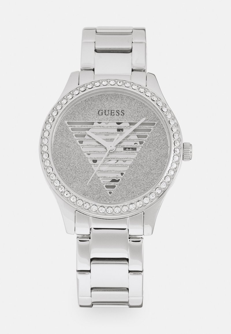 Reloj plateado con un dial gris brillante que presenta un diseño de recortes en forma de triángulo y acentos de cristal alrededor del bisel. Banda de acero inoxidable.