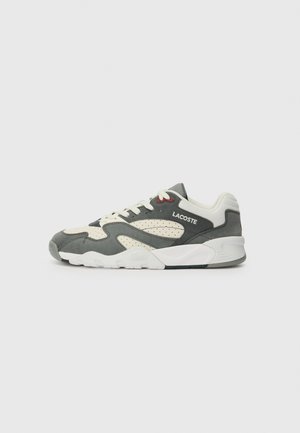 Gray and cream athletic sneaker with perforated side panels, white laces, and a white rubber sole. Features subtle red accents and logo.