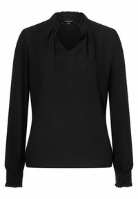 Svart blus med lång ärm, rynkade muddar och en liten volangkrage, med en diskret V-ringning och en slät tygkvalitet.