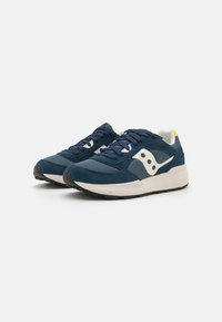 Dark blue sneakers featuring a mix of suede and mesh materials, white accents, textured rubber sole, and prominent branding.