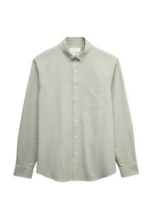 Jasnozielona koszula z długim rękawem, klasycznym kołnierzykiem, zapinana na guziki, z jedną kieszonką na klatce piersiowej i lekko zaokrąglonym dołem. Wykonana z bawełny.