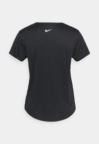 Black Nike t-shirt with short sleeves, round neck, smooth texture, and a white Nike logo on the upper back. Hem is curved.