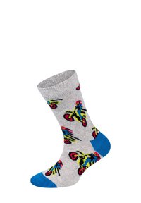 Grå sok med et farverigt motorsykkelmønster, indbygget blå accenter på hæl og tå, vist oprejst mod en hvid baggrund.