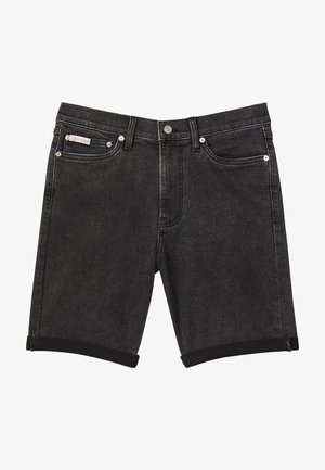 Černé džínové šortky s ohrnutými lemy, předním knoflíkem a zipem, pěti kapsami a malou značkou Calvin Klein na pravé přední kapse.