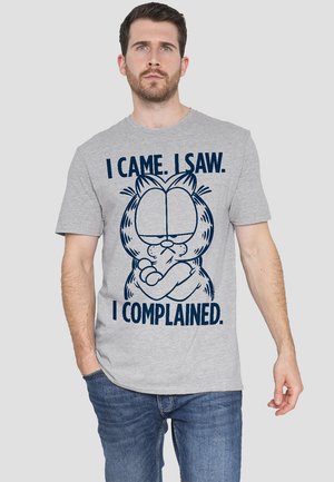 Gray cotton t-shirt featuring a cartoon character with crossed arms. Text reads: "I CAME. I SAW. I COMPLAINED." in navy blue.