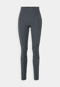 Legginsy z wysokim stanem, w ciemnoszarym kolorze, charakteryzujące się gładką teksturą, panelem i kontrastującymi przeszyciami, które dodają wizualnego zainteresowania.