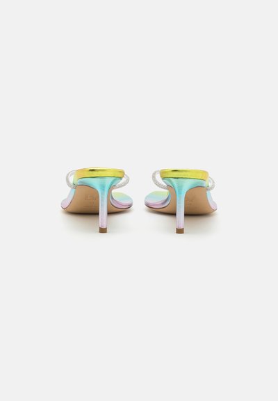 Heeled sandals with a gradient finish transitioning from gold to blue, featuring a slim heel and transparent straps. Smooth texture.