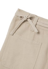 Beige corduroy broek met een trekkoord in de taille, voorzien van ribbeltextuur en een enkele achterzak.