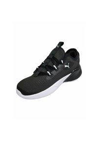 Scarpa sportiva nera con tomaia texturizzata, suola bianca e lacci. Presenta un design elegante con colletto imbottito e accentuazione del logo.