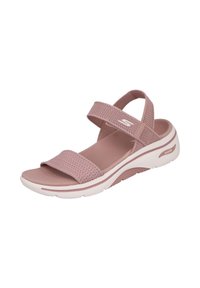 Sandalia de malla rosa con dos correas ajustables, plantilla acolchada y suela blanca gruesa con un diseño ligeramente curvado.