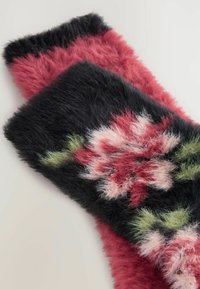 Soft, fuzzy gloves with black and pink colors, featuring a floral pattern with green leaves on the wrist area.