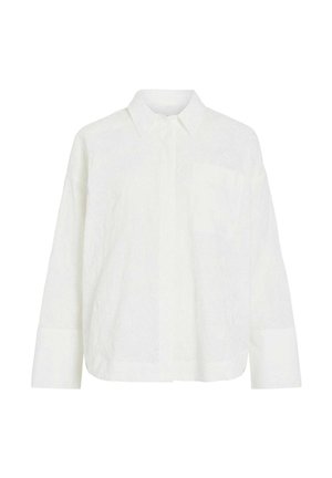 White long-sleeve shirt with chest pocket, pointed collar, front button placket, and wide cuffs, displayed on a plain background.