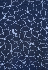 Navy fabric with light blue floral pattern; features large petals and small circular accents, emphasizing texture and design detail.