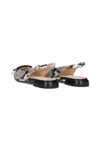 Slingback flat shoes featuring a black and white snake print pattern, smooth texture, and a black rubber sole with a small heel.