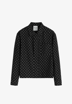 Chemise noire à manches longues, boutonnée, avec un motif géométrique de chaînes blanches, un col et une poche poitrine, étiquetée taille L par Frilivin.