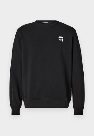 Zwarte sweatshirt met ronde halslijn, ribgebreide manchetten en zoom. Heeft een kleine grafische afbeelding op de borst en de merknaam gedrukt op de mouw.