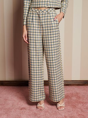 Wool-blend high-waisted wide-leg trousers in a yellow, blue, and cream check pattern. Features side pockets and a clean finish at the hem.