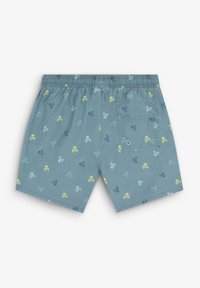 Pantaloni da bagno azzurri chiari con una texture morbida, caratterizzati da un motivo di teschi giocoso in giallo e verde. Vita elastica e dettaglio della tasca posteriore.