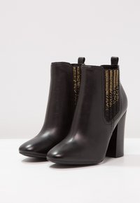 Guess Bottines à talons hauts - black