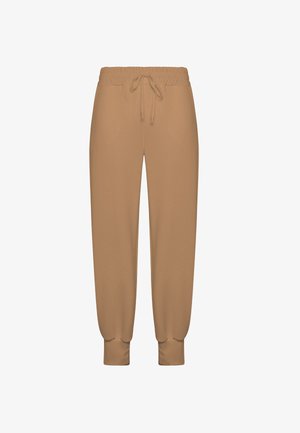 Beige joggebukser med elastisk linning, snøre og manchetter ved anklerne. Glat tekstur med en afslappet pasform for komfort.