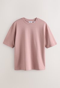 Luźna bawełniana koszulka z krótkim rękawem w stonowanym różowym kolorze z okrągłym dekoltem, ukazana na jasnym tle, rozłożona na płasko.