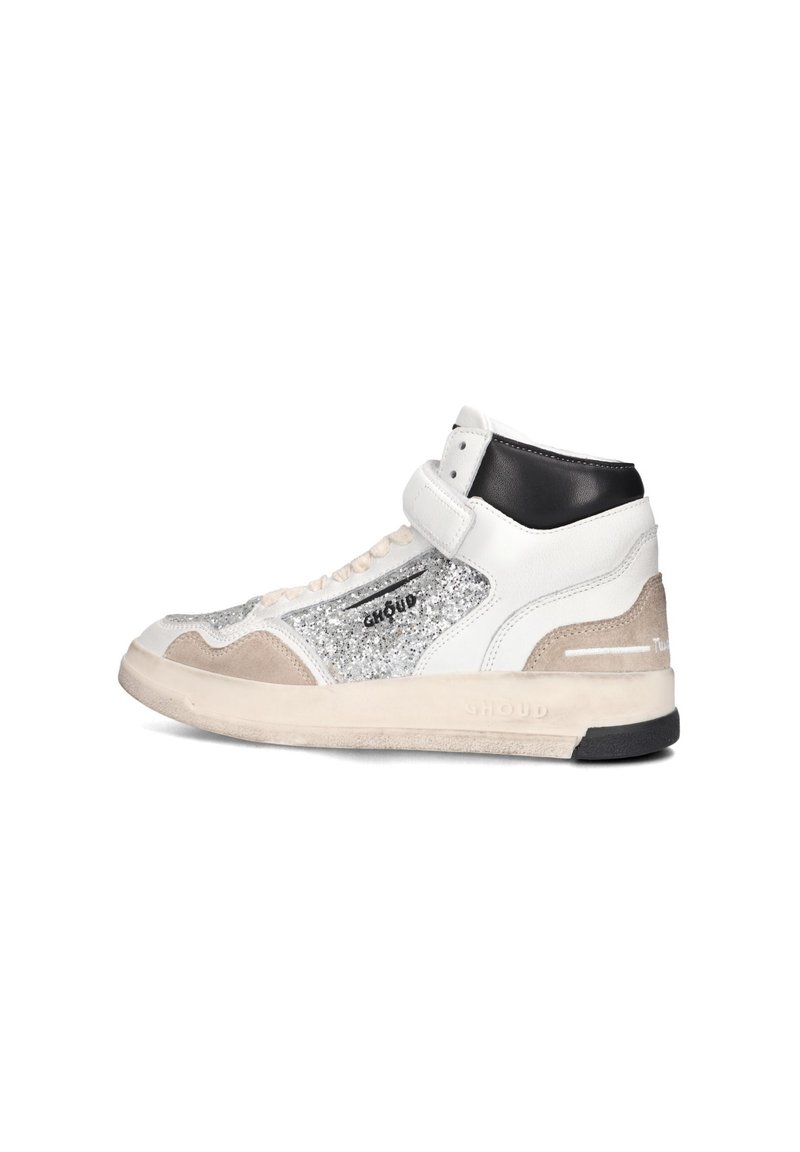High-top sneakers in white leather with silver glitter accents, beige suede details, and a black leather heel. Features a Velcro strap.