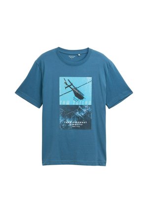 Modrá bavlnená tričko s grafikou helikopt�éry, bielym textom a textúrovanými detailmi na potlači. Krátke rukávy a okrúhly výstrih.