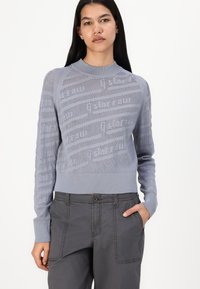 Sky blue knitted sweater with a textured pattern and ribbed cuffs and hem. The design features a crew neckline and a fitted silhouette.