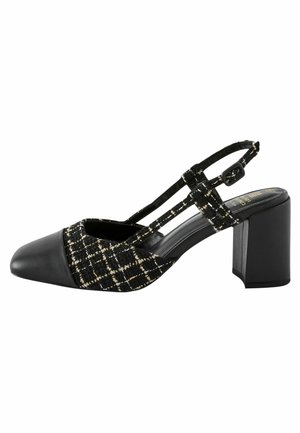 Chaussure slingback en tweed noir et blanc avec bout en cuir pointu et talon bloc épais, dotée d'une bride réglable avec boucle.