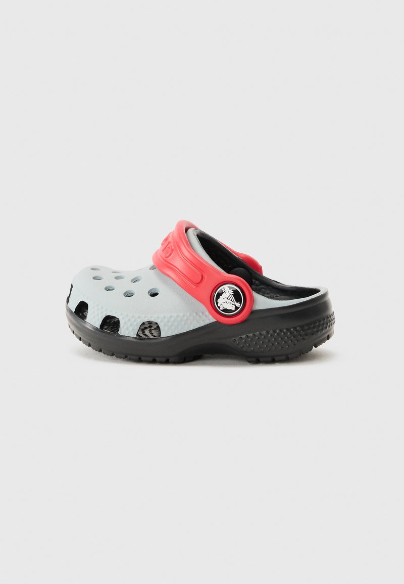 Gray and black lightweight clog featuring red strap, circular logo, ventilation holes, and textured sole for grip.