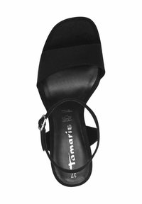 Sandale à talons noire avec une tige en suede et une fine sangle à la cheville. Présente un design à bout ouvert et une semelle intérieure en cuir rembourrée pour le confort.