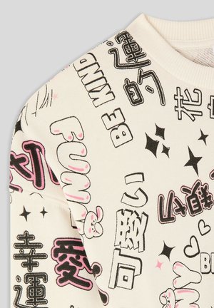 Felpa bianca con stampe grafiche multicolori, inclusi testo ed elementi di cartoni animati. Texture morbida con scollo rotondo e polsini a costine.