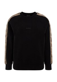 Sudadera negra con franjas laterales beige que presentan un patrón repetido de logotipos; cuello y puños acanalados, con un estampado de logo delantero.