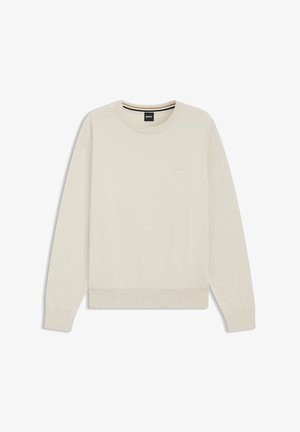 Vaaleanbeige pyöreäkauluksinen collegepaita pehmeästä kankaasta, jossa on resorit hihansuuissa ja helmassa, sekä hillitty logo rinnassa.