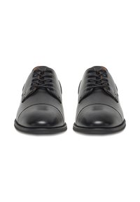 Black leather shoes with a rounded toe, smooth texture, and contrasting stitching. Features include lace-up closure and minimalistic design.