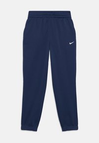 Pantalons de survêtement Nike bleu marine avec taille élastique et poignets, ornés d'un petit logo Swoosh blanc sur la cuisse droite.