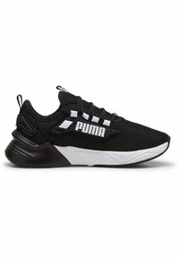 Zapatilla deportiva negra con parte superior de malla, acentos blancos, logo prominente en el lateral y una suela gruesa y acolchada con agarre texturizado.