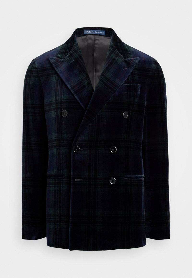 Veste à double boutonnage à carreaux en vert foncé et bleu marine, en velours. Présente de grands revers crantés et deux poches avant.