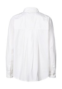 Chemise blanche à manches longues avec un détail de pli au dos, des poignets à boutons et un col classique. Fabriquée en tissu de coton texturé.