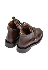 Brown leather ankle boots with a smooth finish, rounded toe, contrasting dark wooden sole, and olive green laces.