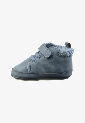 Blue toddler shoe with soft lining, two elastic straps, and a velcro closure on white background.