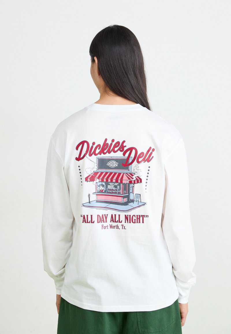 White long-sleeve shirt featuring a graphic of a deli cart with a red and white striped awning, text reading “Dickies Deli" and "All Day All Night."