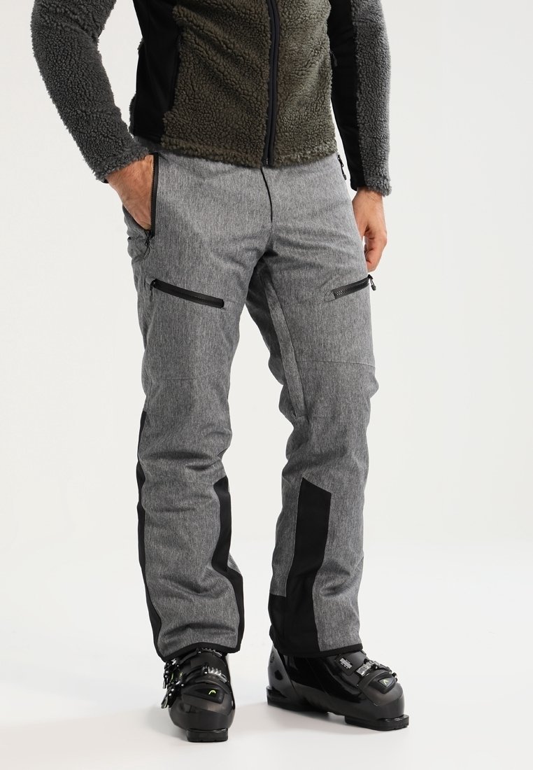 Pantalons de ski gris avec accents noirs, deux poches zippées et une coupe ajustée. Fabriqués en tissu durable, adaptés aux sports d'hiver.