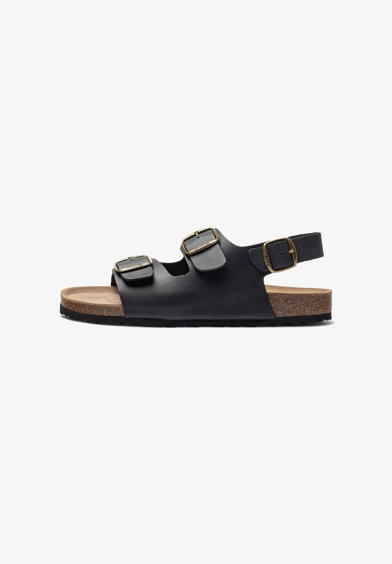 Black leather sandals with cork footbed, featuring two adjustable straps and a back strap with gold-tone buckles. Textured rubber sole.