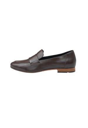 Brown leather loafers with a low heel, featuring a stitched toe and a decorative strap across the vamp. Smooth texture with a shiny finish.