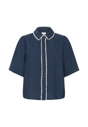 Blouse bleu marine à manches courtes avec col pointu, boutonnage sur le devant et bordure blanche en forme d'ondes le long du col et de la patte de boutonnage.
