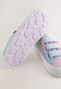 Glittery gradient sneakers with blue, pink, and purple tones. Designed with two Velcro straps, textured white sole featuring playful food patterns.