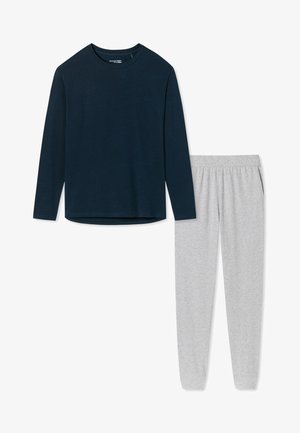 Chemise à manches longues bleu marine avec un col rond, associée à un pantalon taille élastique gris clair. Les deux sont fabriqués dans un tissu doux et extensible.