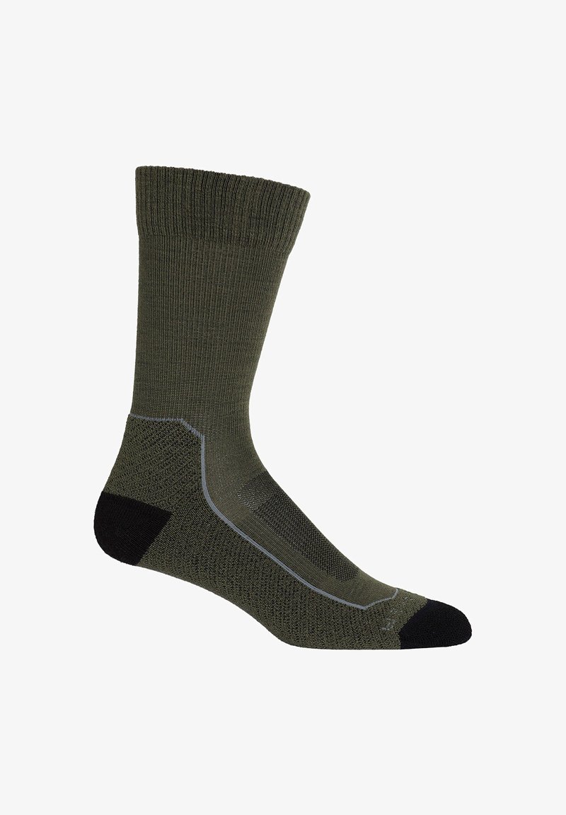 Oliwkowa skarpetka z ściągaczem, wzmocnionym czarnym palcem i piętą, teksturowanym wzorem dzianiny oraz szarymi akcentującymi liniami po bokach.